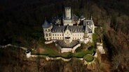 An aerial view shows the castle of Marienburg. © dpa-Bildfunk Photo: Julian Stratenschulte