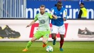   Maximilian Arnold (Wolfsburg, l.) Against David Kinsombi (Kiel) © image / Agency 54 Digg d Photo log aaf: Christian Schaffrath 