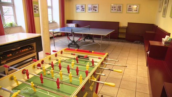 An empty common room of a youth club.  