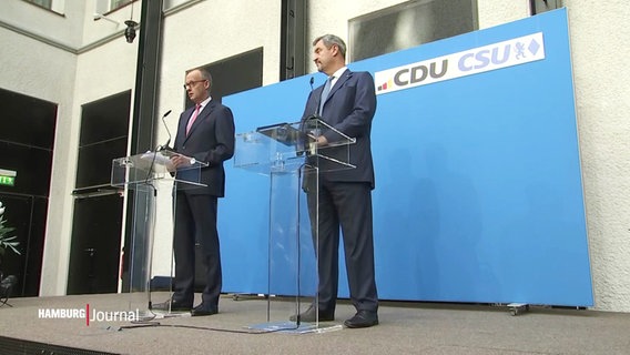 Friedrich Merz und Markus Söder auf einer Bühne. © Screenshot 