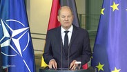 Bundeskanzler Olaf Scholz bei einer Rede © Screenshot 