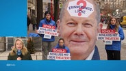 Menschen bei einer Protestaktion gegen Olaf Scholz. © Screenshot 