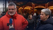 Ein Mann und eine Frau auf dem Hamburger Weihnachtsmarkt © Screenshot 