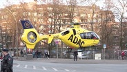 Einn gelber Rettungshubschrauber des ADAC. © Screenshot 