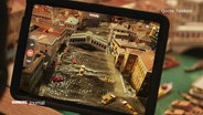 Mit Hilfe eines Tablets kann man im Miniatur Wunderland ab sofort sehen, welche Auswirkungen ein Temperaturanstieg auf verschiedene Orte der Welt haben könnte. © Screenshot 