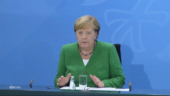 Merkel bei der Konferenz zu Corona.  
