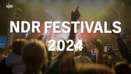 Über dem Bild einer Bühne steht auf einer Texttafel: NDR Festivals 2024 © NDR 