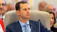 Baschar al-Assad, Präsident von Syrien, während des arabischen Gipfels. © picture alliance/dpa/Saudi Press Agency/AP 