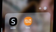 Die Apps der chinesichen Billiganbieter Temu und Shein auf einem Handydisplay. © IMAGO Foto: SOPA Images