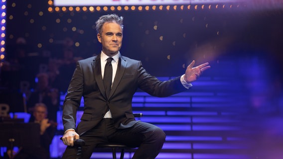 Der Film „Better man“ über das Leben von Robbie Williams. © picture alliance 