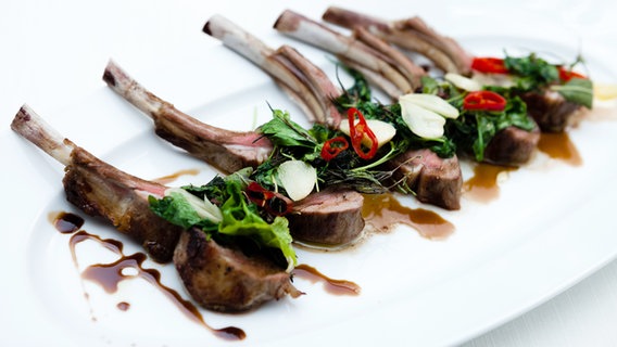 Grilled lamb chops arranged on a plate.  © Colourbox Photo: Maksim Toome