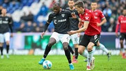 Hannovers Fabian Kunze (r.) im Zweikampf mit Münsters David Kinsombi © Imago Images 