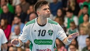 Handballprofi Renasr Uscins von der TSV H.-Burgdorf. © IMAGO / Eibner 