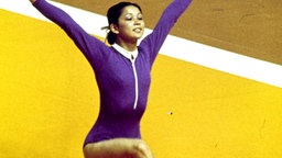 Nelli Kim posiert nach Abschluss ihrer Bodenübung bei den Spielen 1976 in Montreal. © picture alliance / united archives