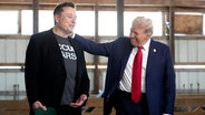 Tesla und SpaceX CEO Elon Musk, links, und designierter US- Präsident Donald Trump © AP Foto: Alex Brandon